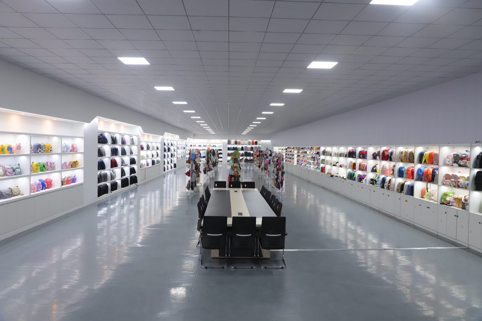 Product showroom displaying bag and hat samples at Sanjin factory